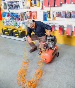 Technician Repairing air compressor