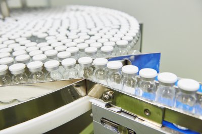 A Conveyor Belt carrying multiple bottles indicating an automated production line in San Jose, CA